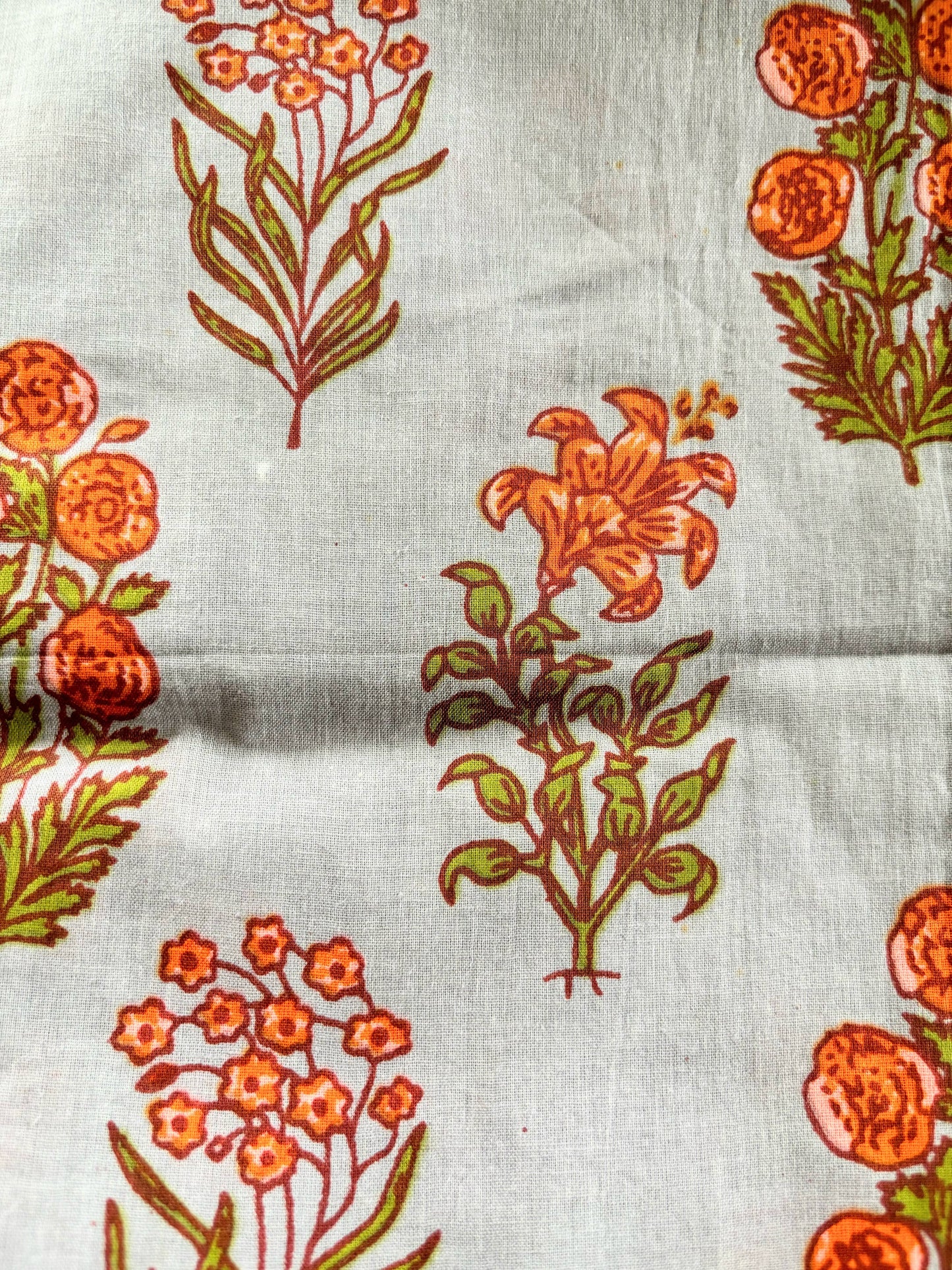 Soft Gray with beautiful orange blooms and light green leaves set in an offset pattern. Comfy and breathable 100% cotton floral lounge and sleep pants with an adjustable waistband, deep side pockets, and a beautiful floral print.