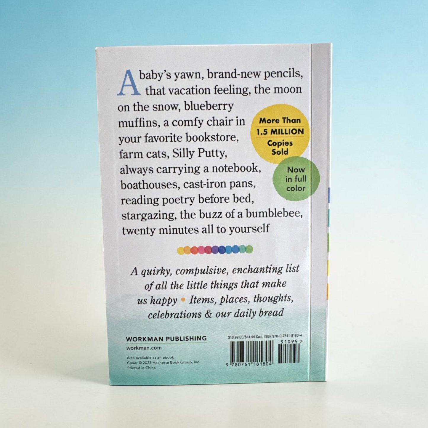 Book back cover with text and branding on a gradient background. “A quirky, compulsive, enchanting list of all the little things that make us happy- items, places-thoughts-celebrations and our daily bread.”