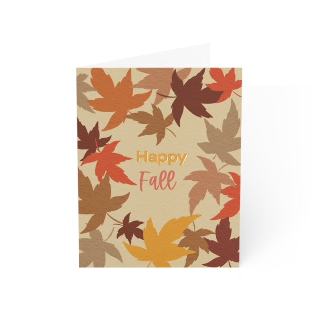 Greeting card featuring 'Happy Fall' in the center, surrounded by falling leaves in orange, red, yellow, dark brown, and lighter brown