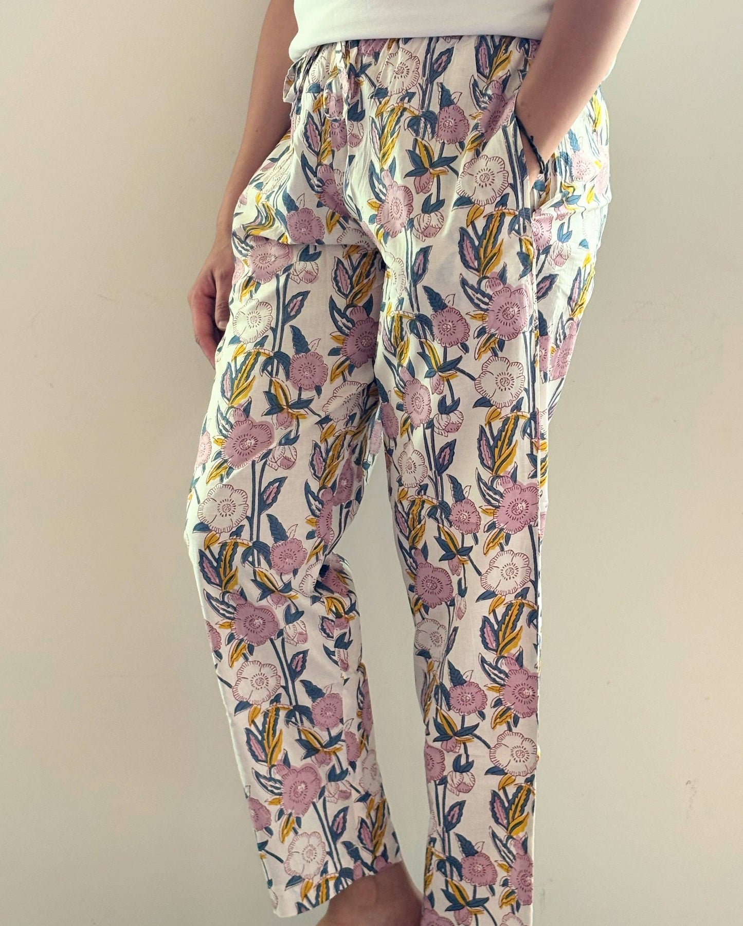 Preshrunk, 100% cotton.Adjustable waistband, big pockets. Comfy and breathable 100% cotton floral lounge and sleep pants with an adjustable waistband, deep side pockets, and a beautiful floral print.