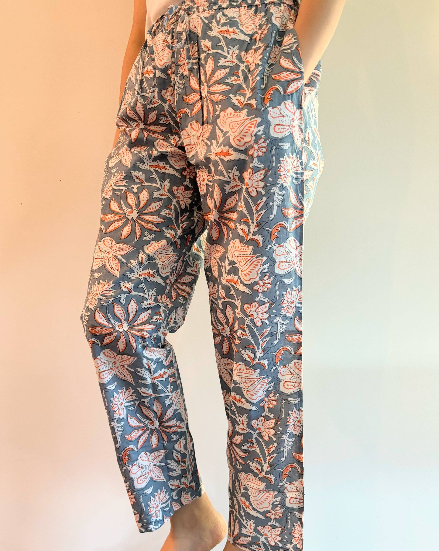 Preshrunk, 100% cotton.Adjustable waistband, big pockets. Comfy and breathable 100% cotton floral lounge and sleep pants with an adjustable waistband, deep side pockets, and a beautiful floral print.