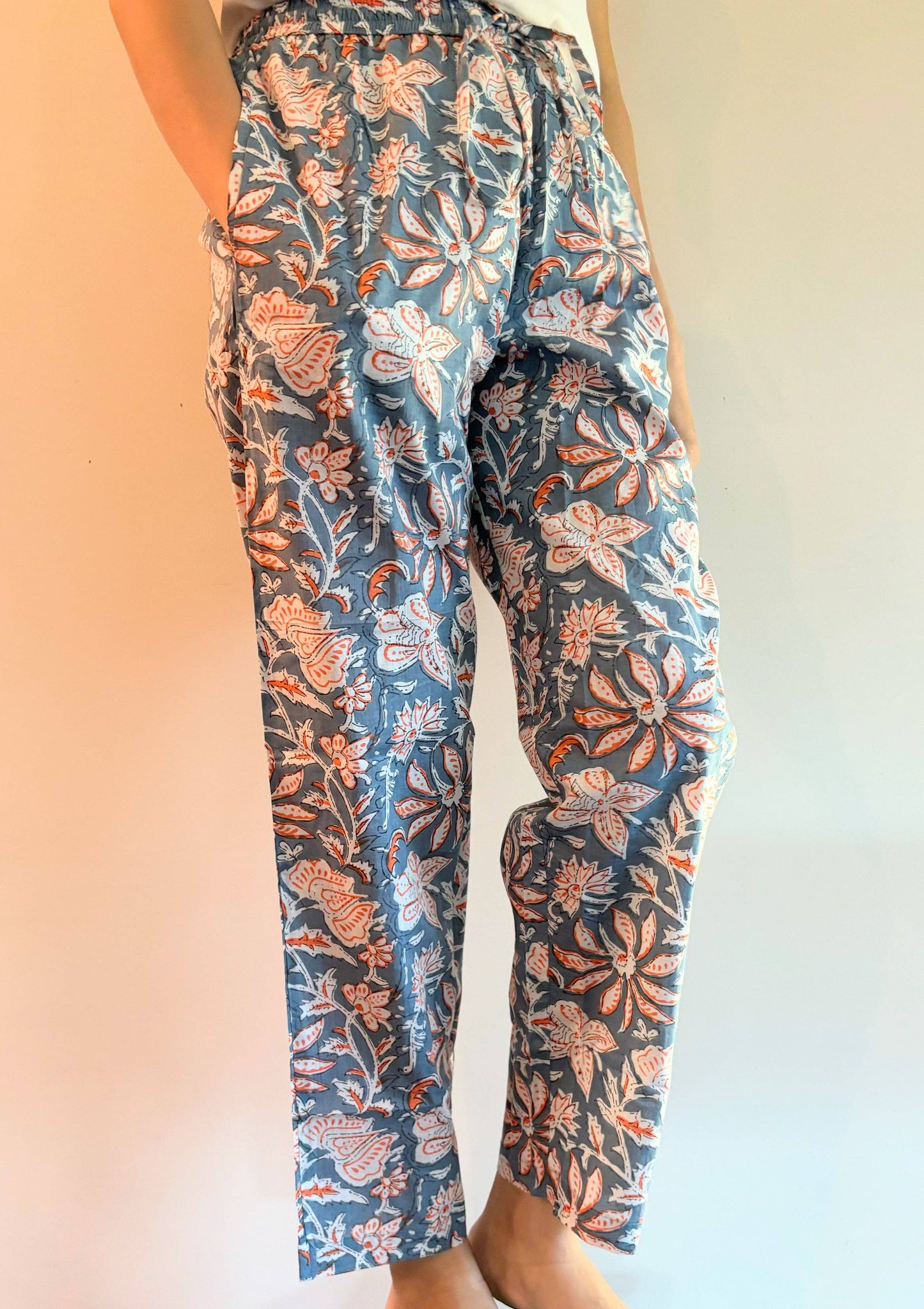 Preshrunk, 100% cotton.Adjustable waistband, big pockets. Comfy and breathable 100% cotton floral lounge and sleep pants with an adjustable waistband, deep side pockets, and a beautiful floral print.