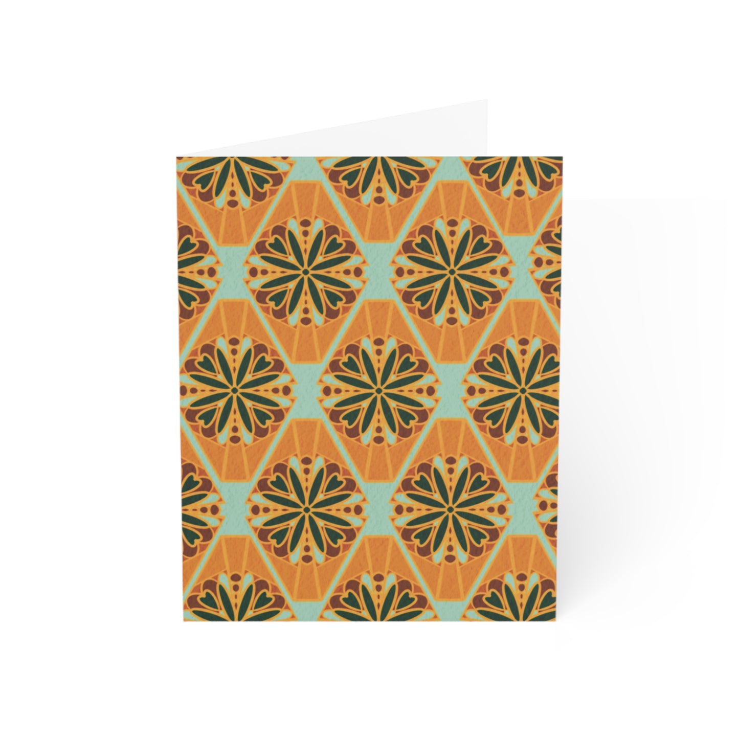 Front of a greeting card featuring a colorful millefiori design, showcasing a repeating pattern of vibrant flower tiles in various hues. Millefiori, an Italian term meaning 'a thousand flowers,' creates a stunning floral mosaic effect. The inside of the card is blank, perfect for personal messages, with the back featuring the text 'Blank inside' and the company logo. Ideal for sending floral greetings, birthday wishes, or any special occasion.