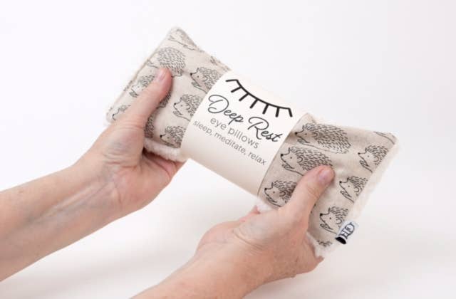 Deep Rest Eye Pillow with rice filling for relaxation, stress relief, and improved sleep, featuring a cotton front and soft minky backing, ideal for heating or cooling