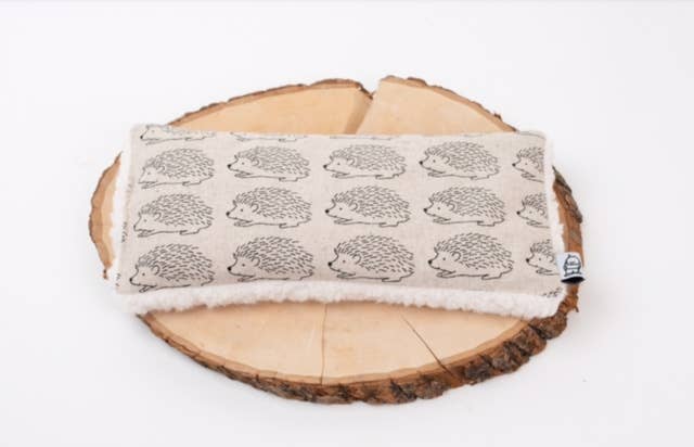 Deep Rest Eye Pillow with rice filling for relaxation, stress relief, and improved sleep, featuring a cotton front and soft minky backing, ideal for heating or cooling