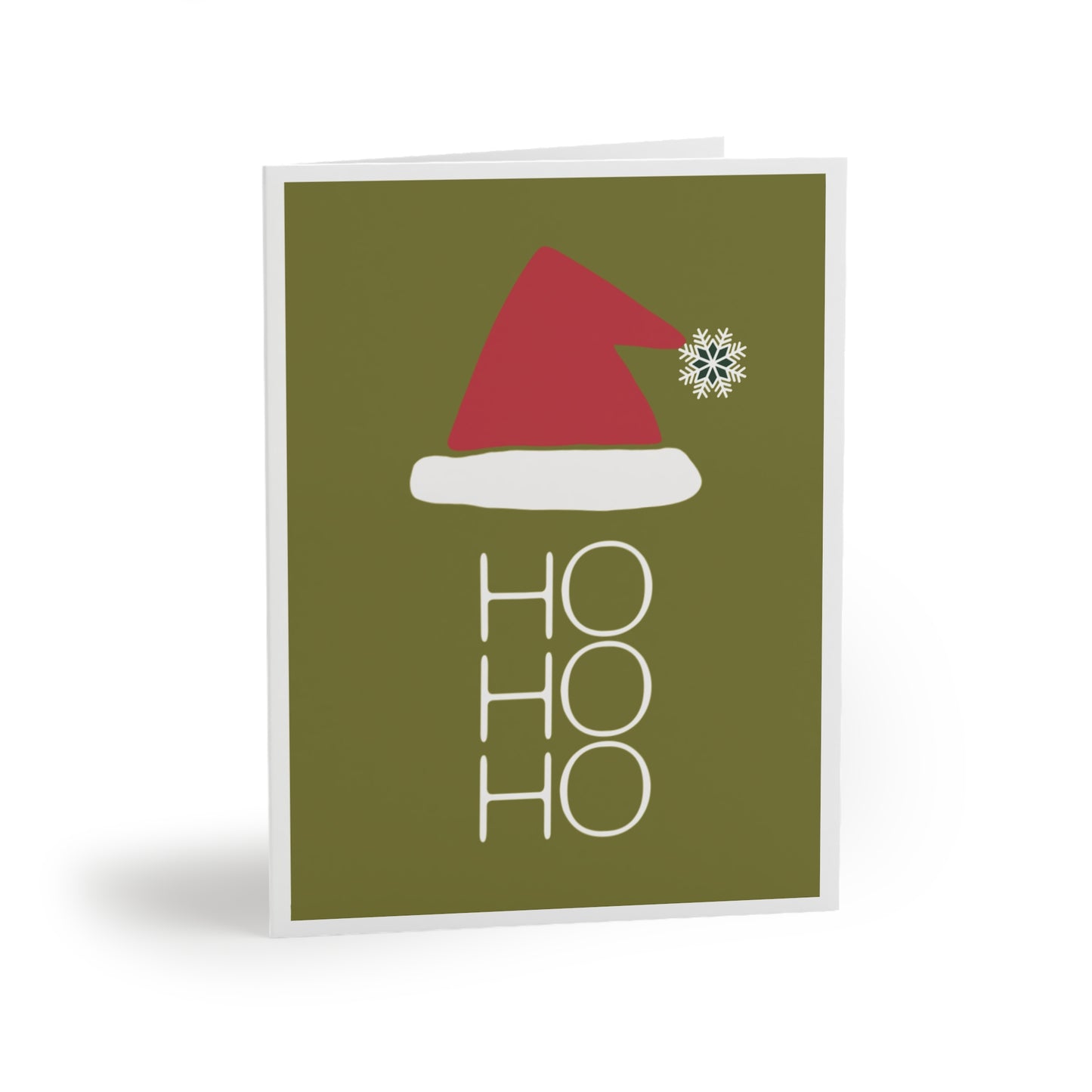 Greeting card featuring a chartreuse green background, a red Santa hat trimmed in white with a white snowflake replacing the pom pom, and 'Ho, Ho, Ho' written in white underneath the hat