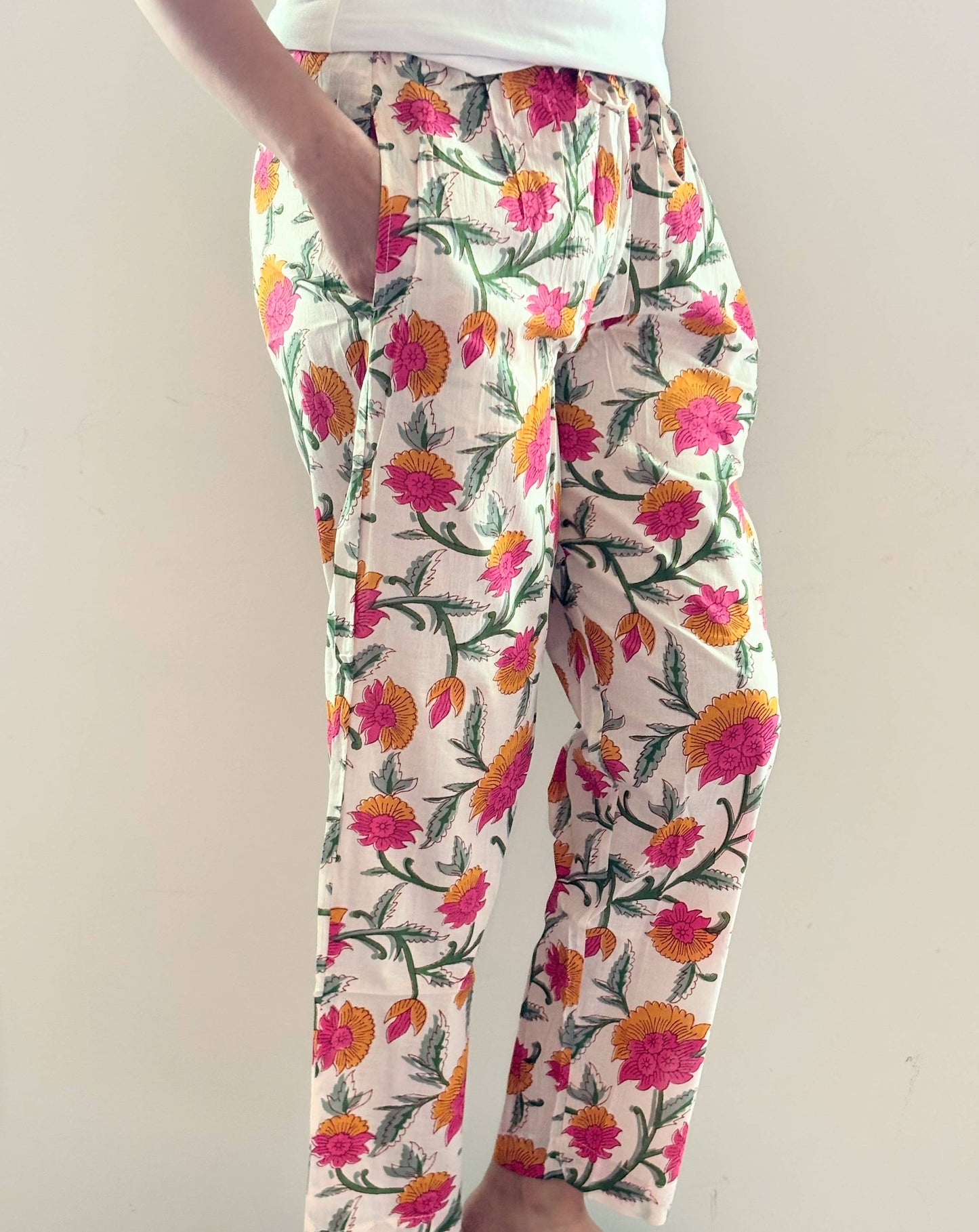 Preshrunk, 100% cotton.Adjustable waistband, big pockets. Comfy and breathable 100% cotton floral lounge and sleep pants with an adjustable waistband, deep side pockets, and a beautiful floral print.