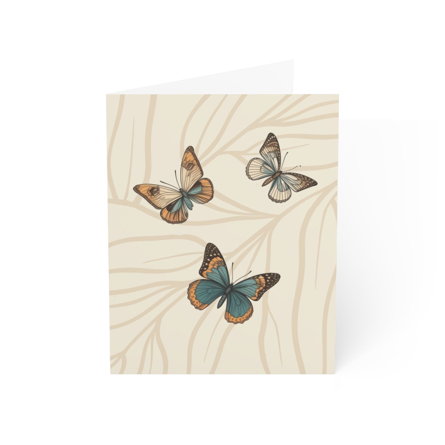 Image shows the front of the greeting card. The Background is cream color with light tan branches covering the whole card. Sitting on the branches are three butterflies of varying size. All in the colors of blue, cream, brown and light orange.