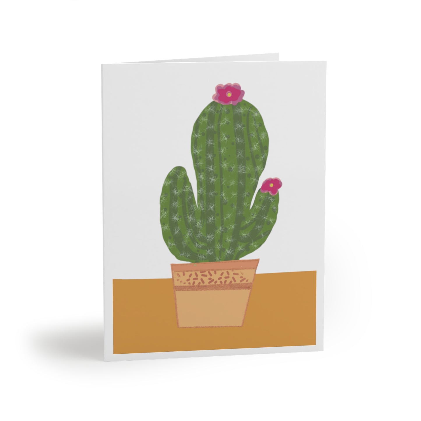 Colorful greeting card featuring a vibrant cactus in a decorative pot, perfect for plant lovers and desert-themed occasions