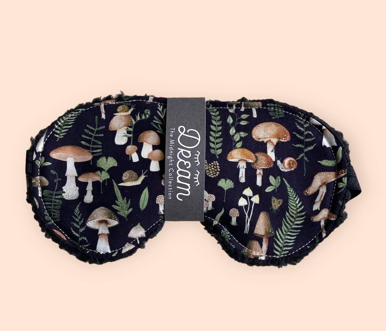Midnight Collection sleep mask featuring 100% cotton front and soft black Sherpa backing, designed for relaxation and a comfortable sleep experience