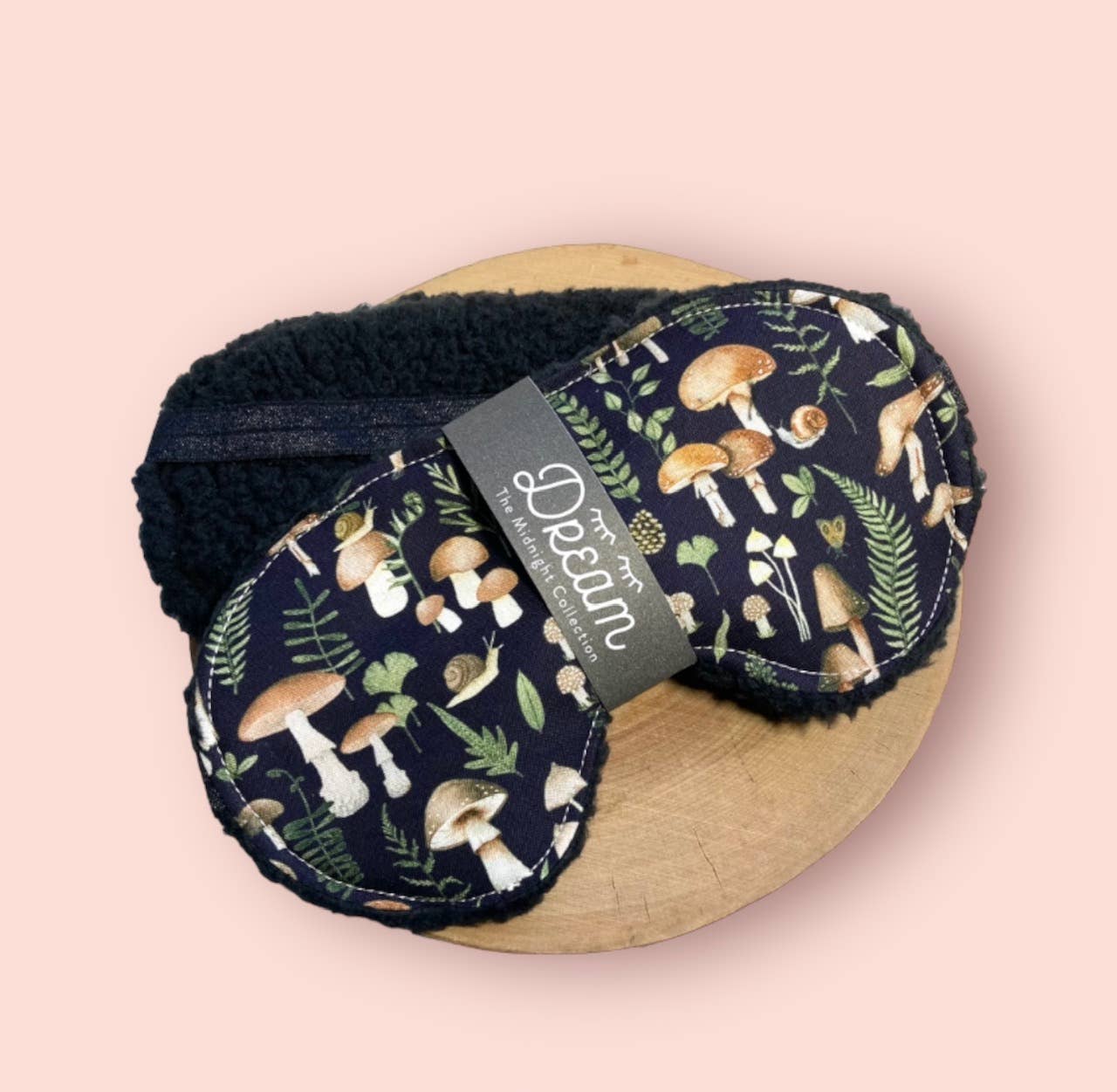 Midnight Collection sleep mask featuring 100% cotton front and soft black Sherpa backing, designed for relaxation and a comfortable sleep experience