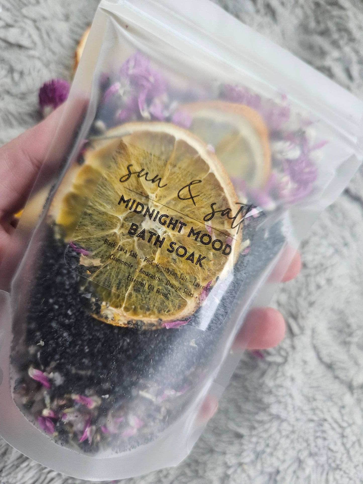 Handmade Midnight Mood Bath Soak with Black Lava Salt, Pink Himalayan Salt, Chamomile, Lavender, Amaranth, Orange Slices, and an essential oil blend for a calming, mood-enhancing bath experience.