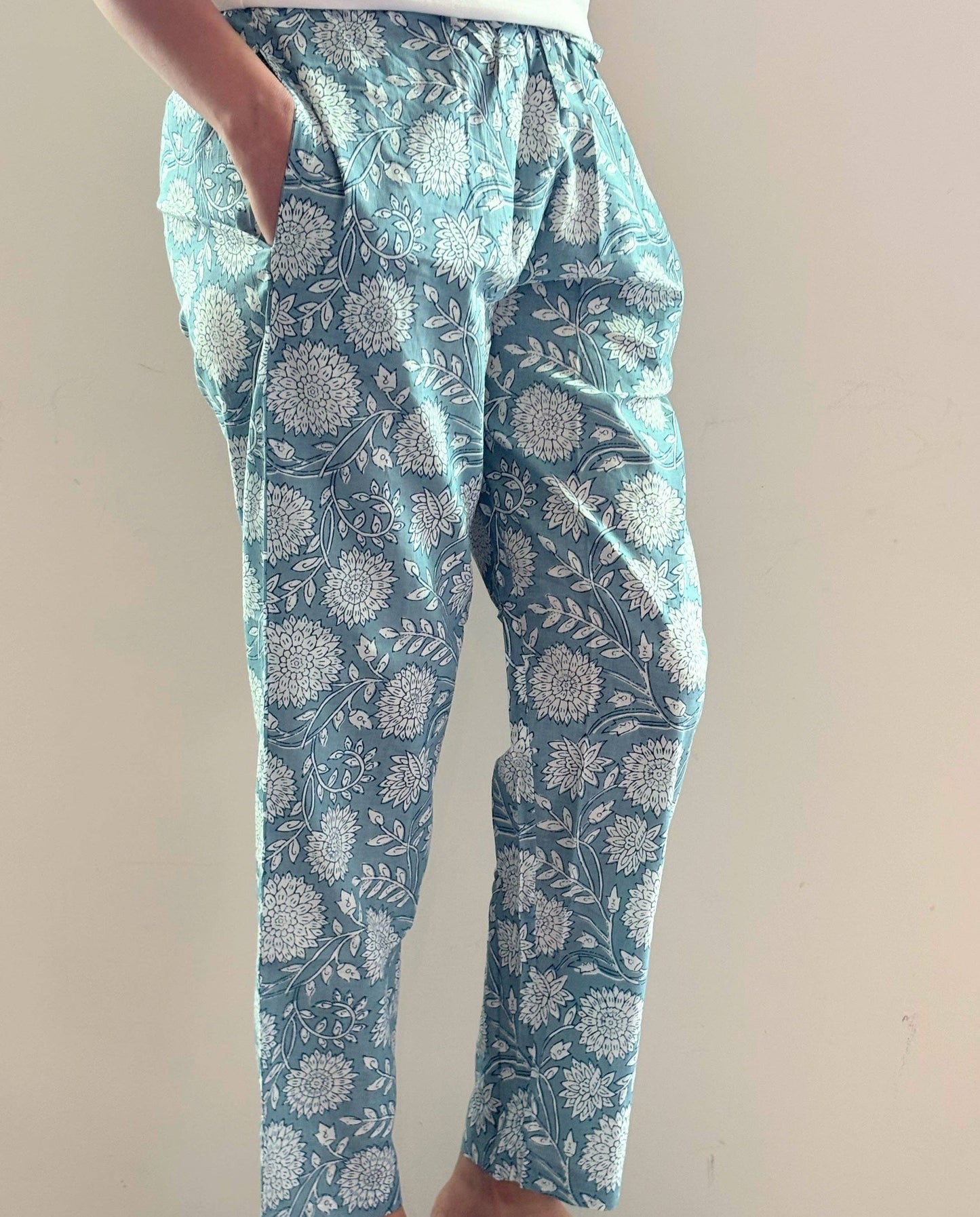 Preshrunk, 100% cotton.Adjustable waistband, big pockets. Comfy and breathable 100% cotton floral lounge and sleep pants with an adjustable waistband, deep side pockets, and a beautiful floral print.