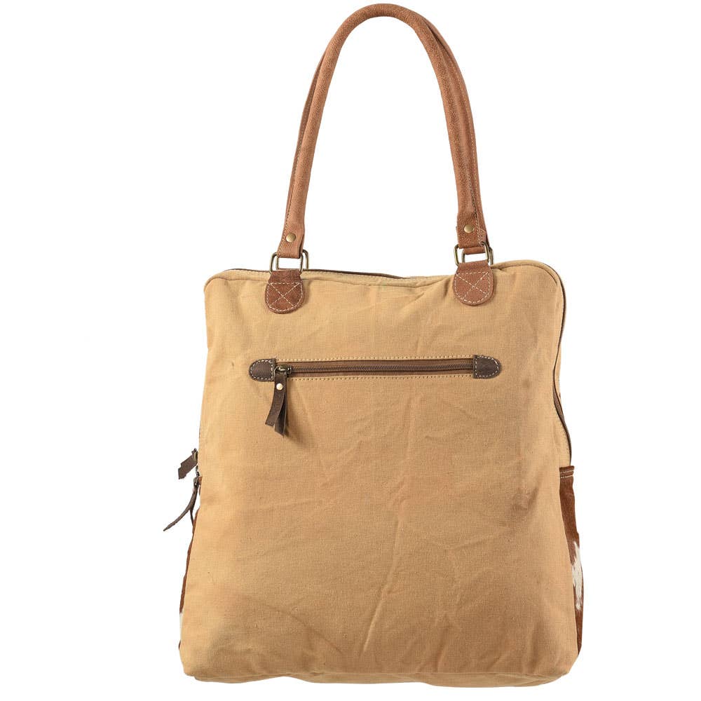 Repurposed canvas back with zippered pocket.