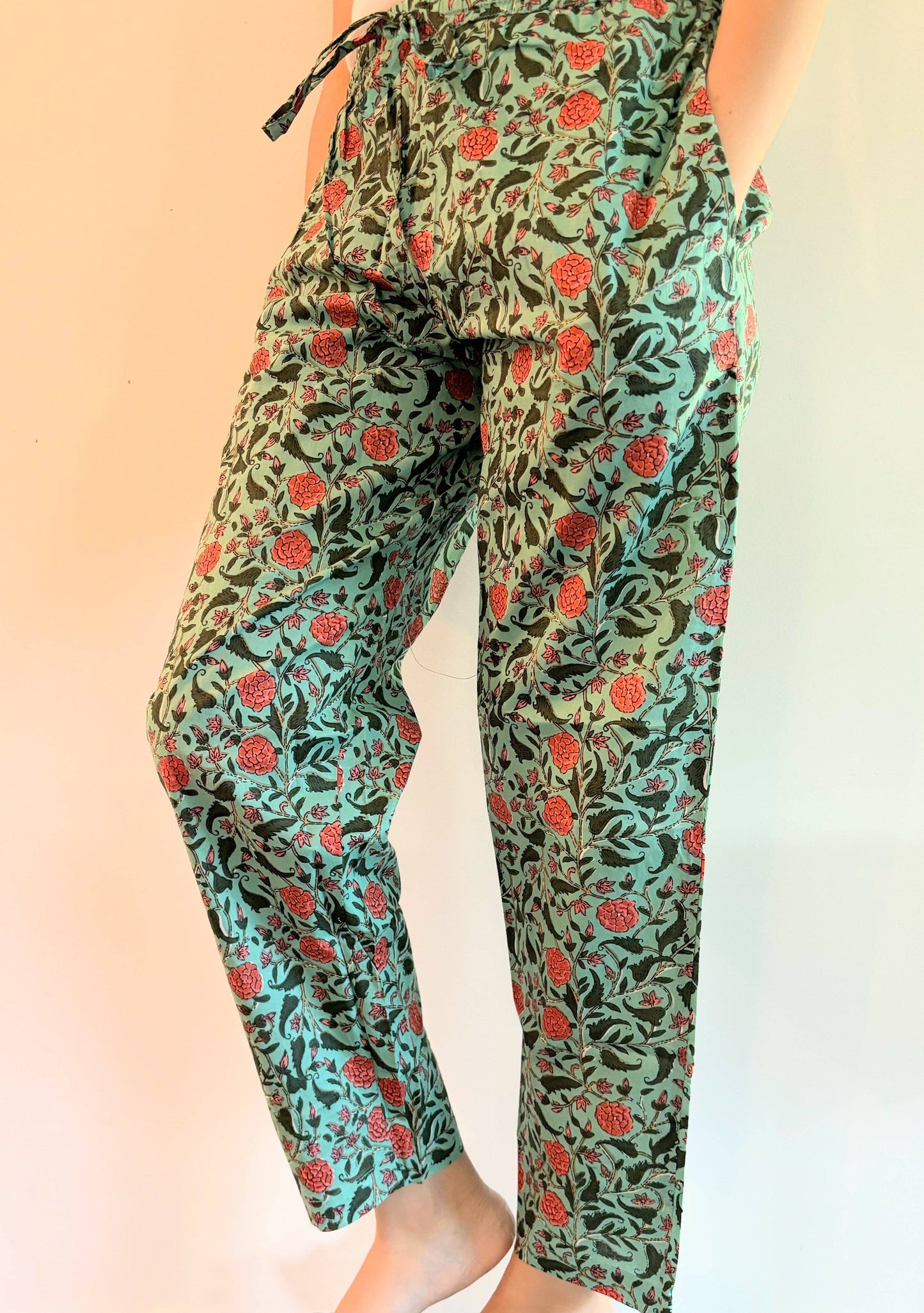 Preshrunk, 100% cotton.Adjustable waistband, big pockets. Comfy and breathable 100% cotton floral lounge and sleep pants with an adjustable waistband, deep side pockets, and a beautiful floral print.