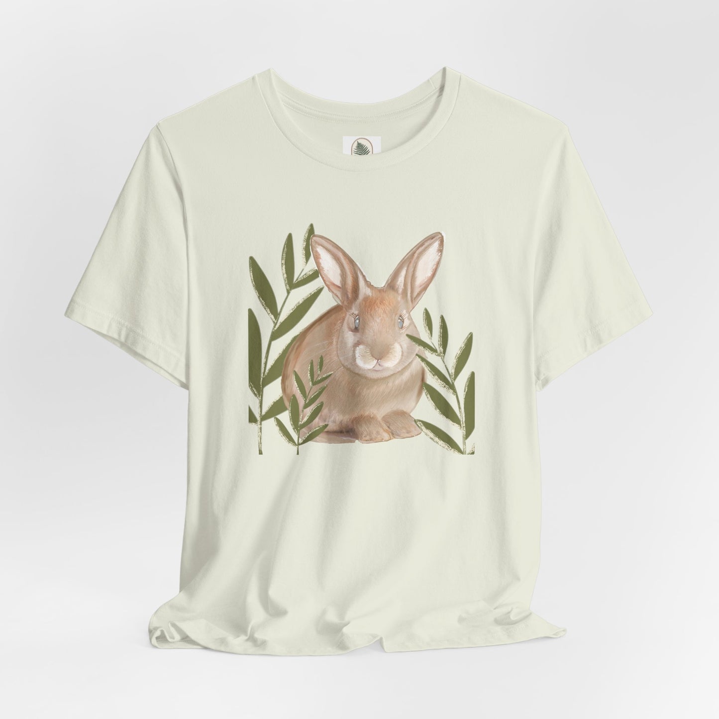 Custom artist sketched bunny graphic tee with playful bunny hiding between blades of grass, perfect for spring and Easter.