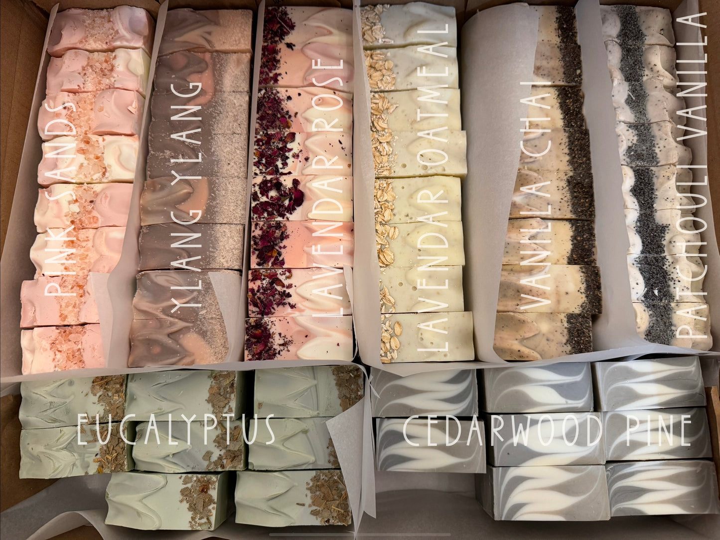 Assorted Handmade Small Batch Artisan Soaps All Natural Vegan. Made with organic coconut oil, shea butter, and saponified olive oil, naturally colored with plant materials.