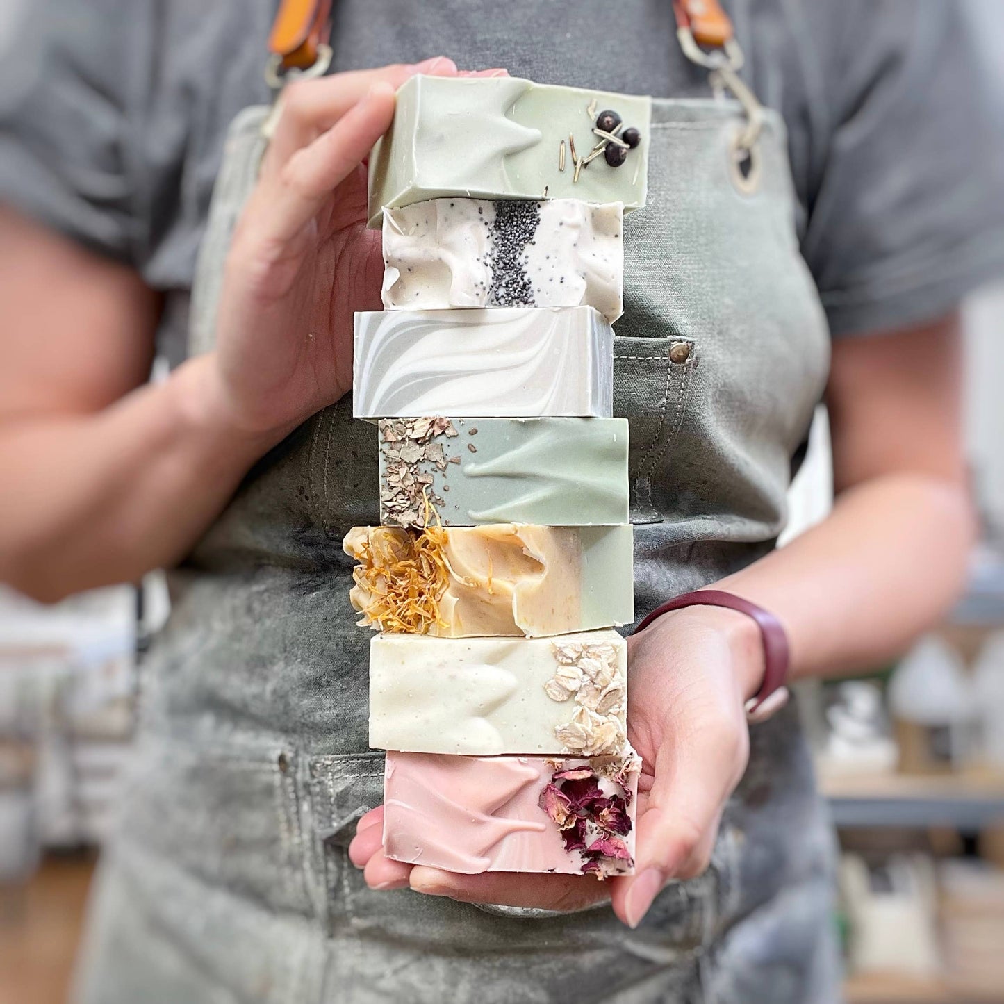 Luxury artisan soap with olive oil, coconut oil, and shea butter, handmade with natural ingredients, safe for all skin types, exfoliating and hydrating soap bars.