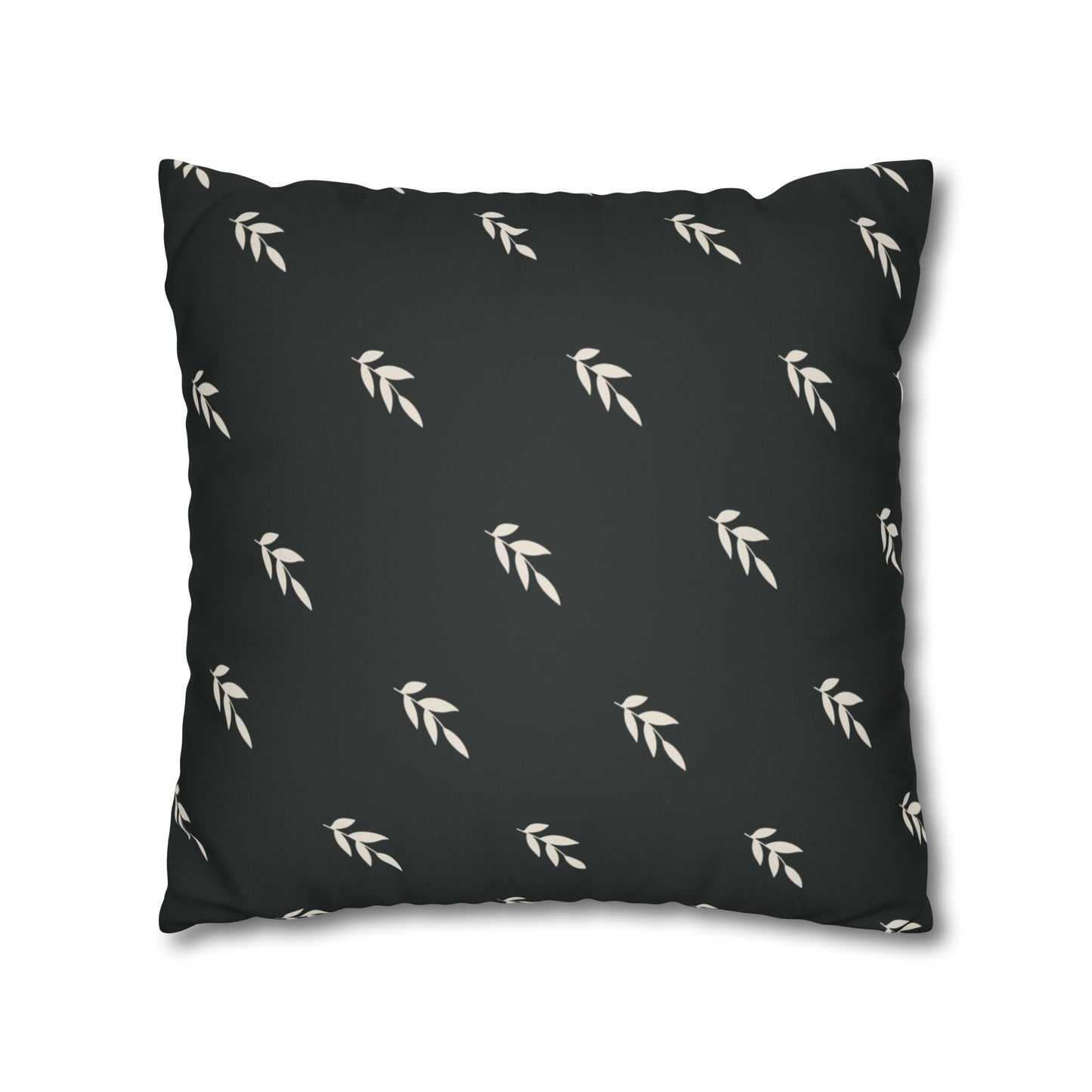 Abstract painted pillow cover featuring a sweet green bird with soulful eyes nestled in a fern leaf. The back of pillow is black with a complementary repeating motif of  tiny crream covered leaves