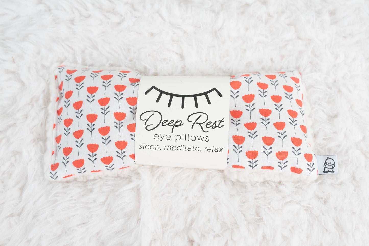Deep Rest Eye Pillow for relaxation, stress relief, and sleep improvement. Features soft cotton front, minky backing, and soothing rice filling for acupressure and comfort. Can be used heated or chilled for enhanced relaxation