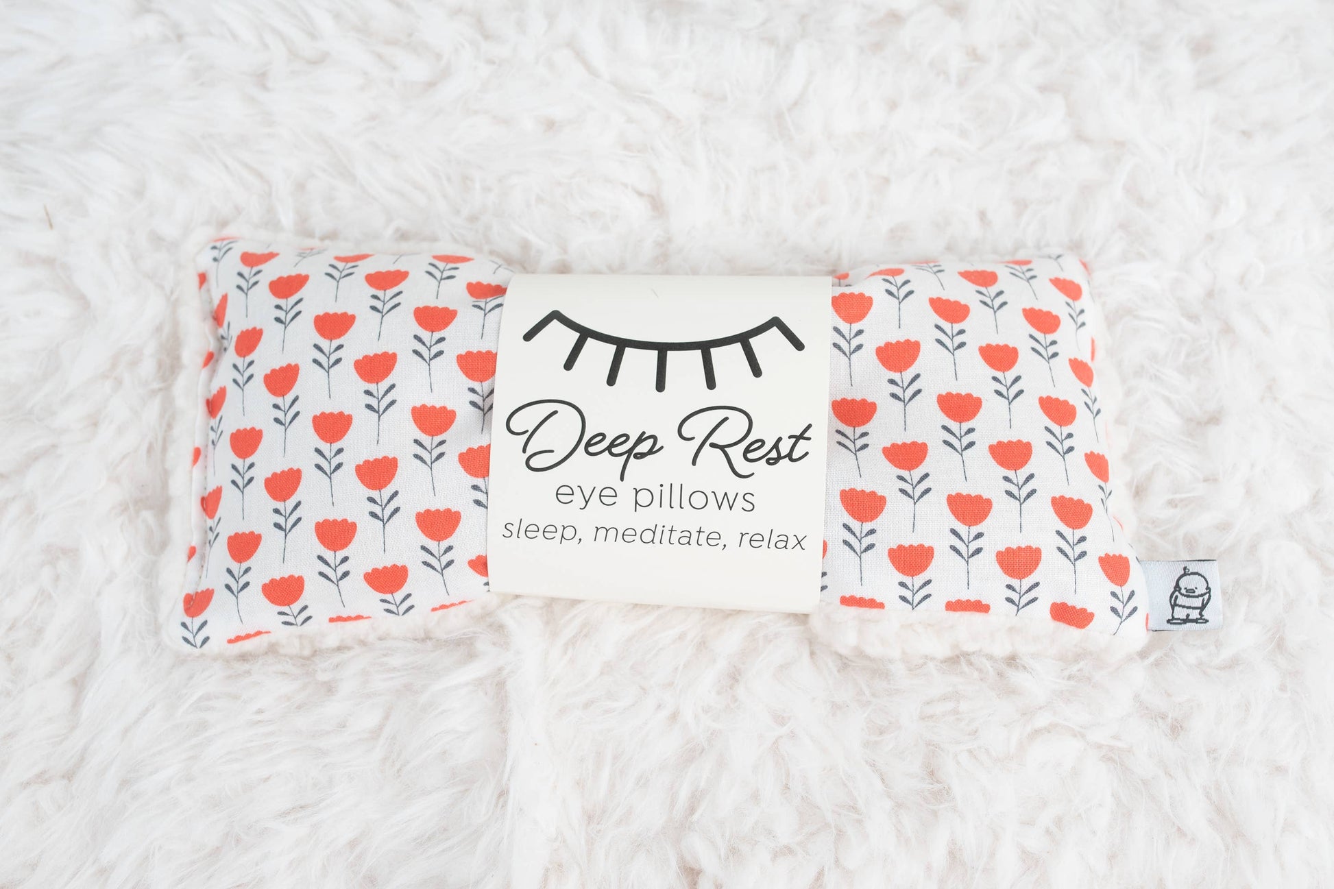 Deep Rest Eye Pillow for relaxation, stress relief, and sleep improvement. Features soft cotton front, minky backing, and soothing rice filling for acupressure and comfort. Can be used heated or chilled for enhanced relaxation