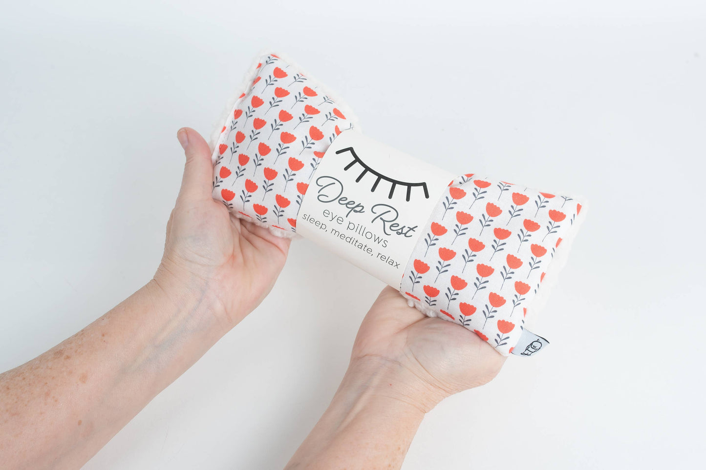 Deep Rest Eye Pillow for relaxation, stress relief, and sleep improvement. Features soft cotton front, minky backing, and soothing rice filling for acupressure and comfort. Can be used heated or chilled for enhanced relaxation