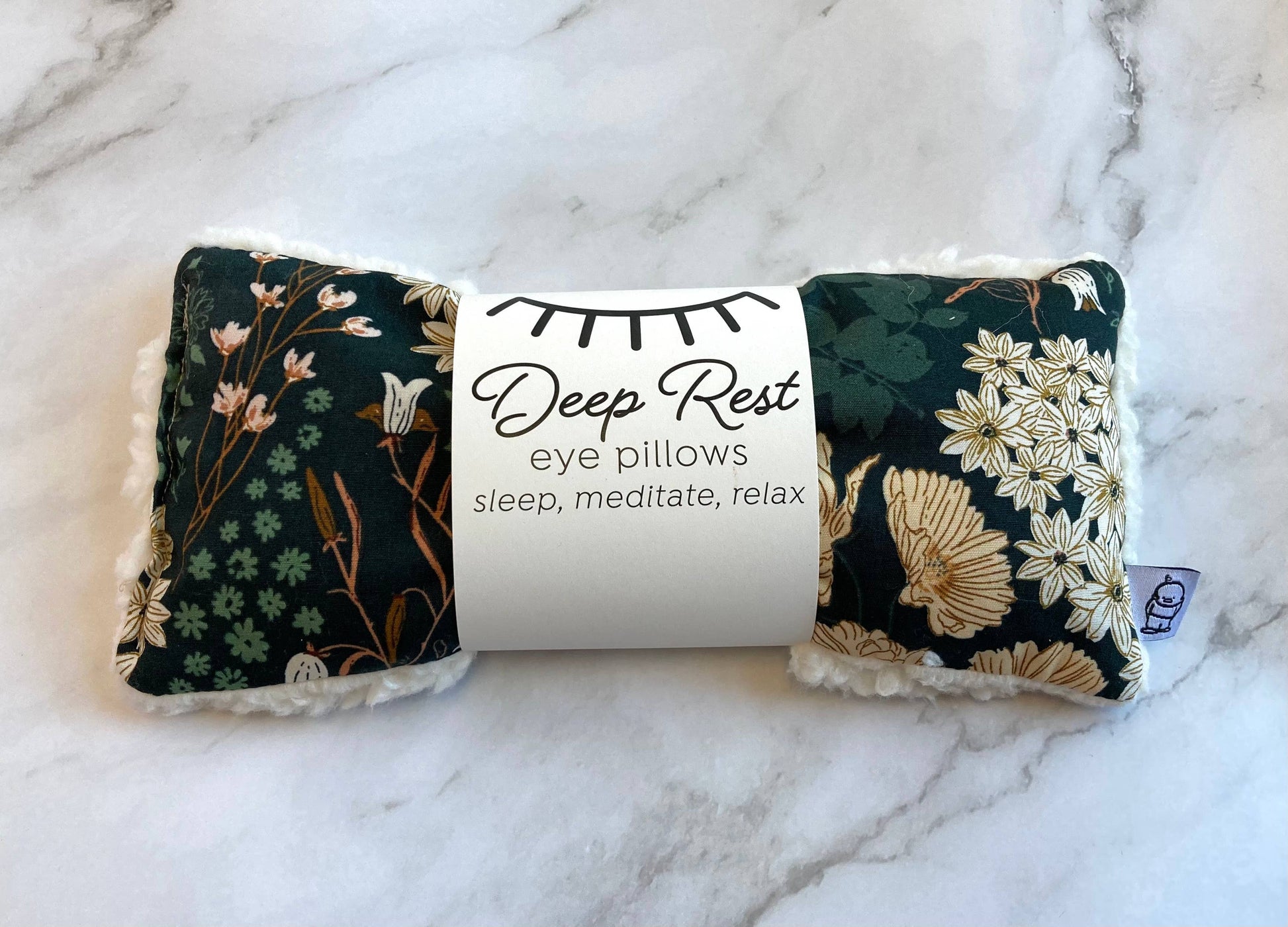 Emerald forest green with creams, peach and lighter green delicate florals - Deep Rest Eye Pillow with rice filling for relaxation, stress relief, and improved sleep, featuring a cotton front and soft minky backing, ideal for heating or cooling.