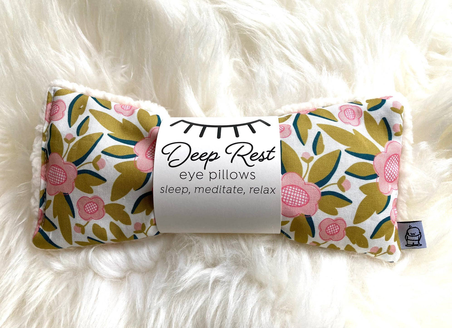 Deep Rest Eye Pillow with rice filling for relaxation, stress relief, and improved sleep, featuring a cotton front and soft minky backing, ideal for heating or cooling