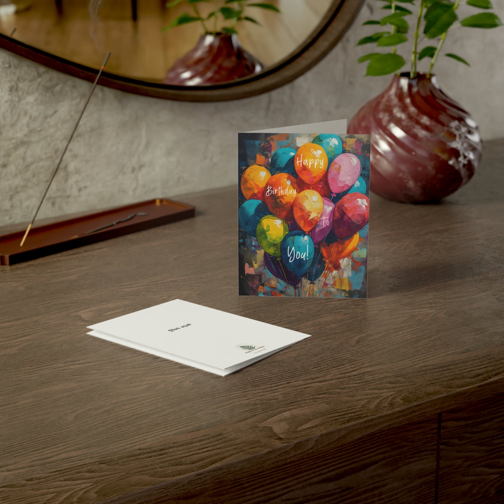 A vibrant eco-friendly birthday card featuring a colorful balloon bouquet, printed on sustainable cardstock with non-toxic inks, blank inside for personalization