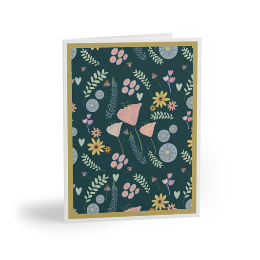 Front of a teal-colored greeting card featuring a soft, pastel floral design with mixed flowers in gentle hues. The card’s elegant teal background complements the pastel flowers, making it perfect for a range of occasions. The inside of the card is blank, ideal for personal messages, with the back displaying the text 'Blank inside' and the company logo