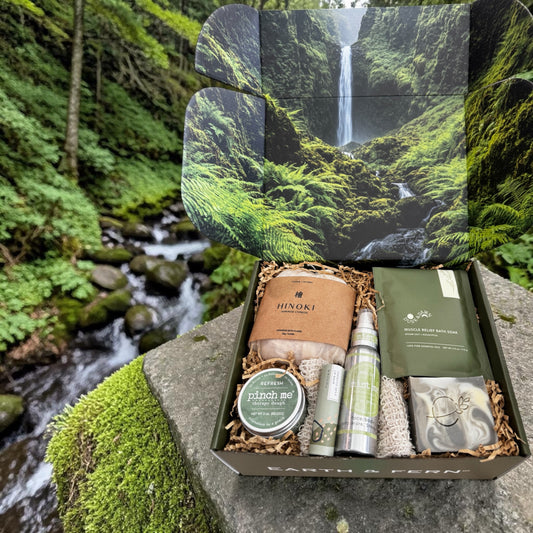 Open Box with Hinoki flakes and muscle bath soak, Aromatherapy spray, therapy dough, mint lip balm and cedarwood pine soap, with a complimentary sisal soap bag.