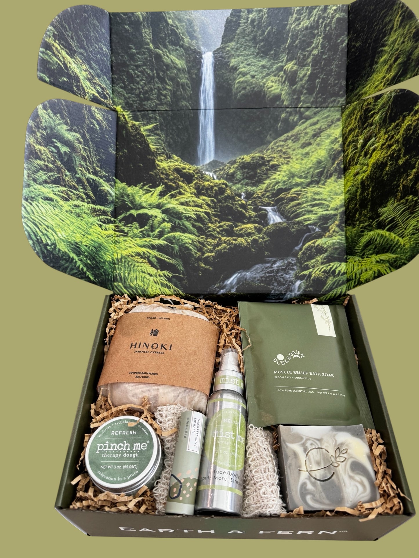 Open Box with Hinoki flakes and muscle bath soak, Aromatherapy spray, therapy dough, mint lip balm and cedarwood pine soap, with a complimentary sisal soap bag.