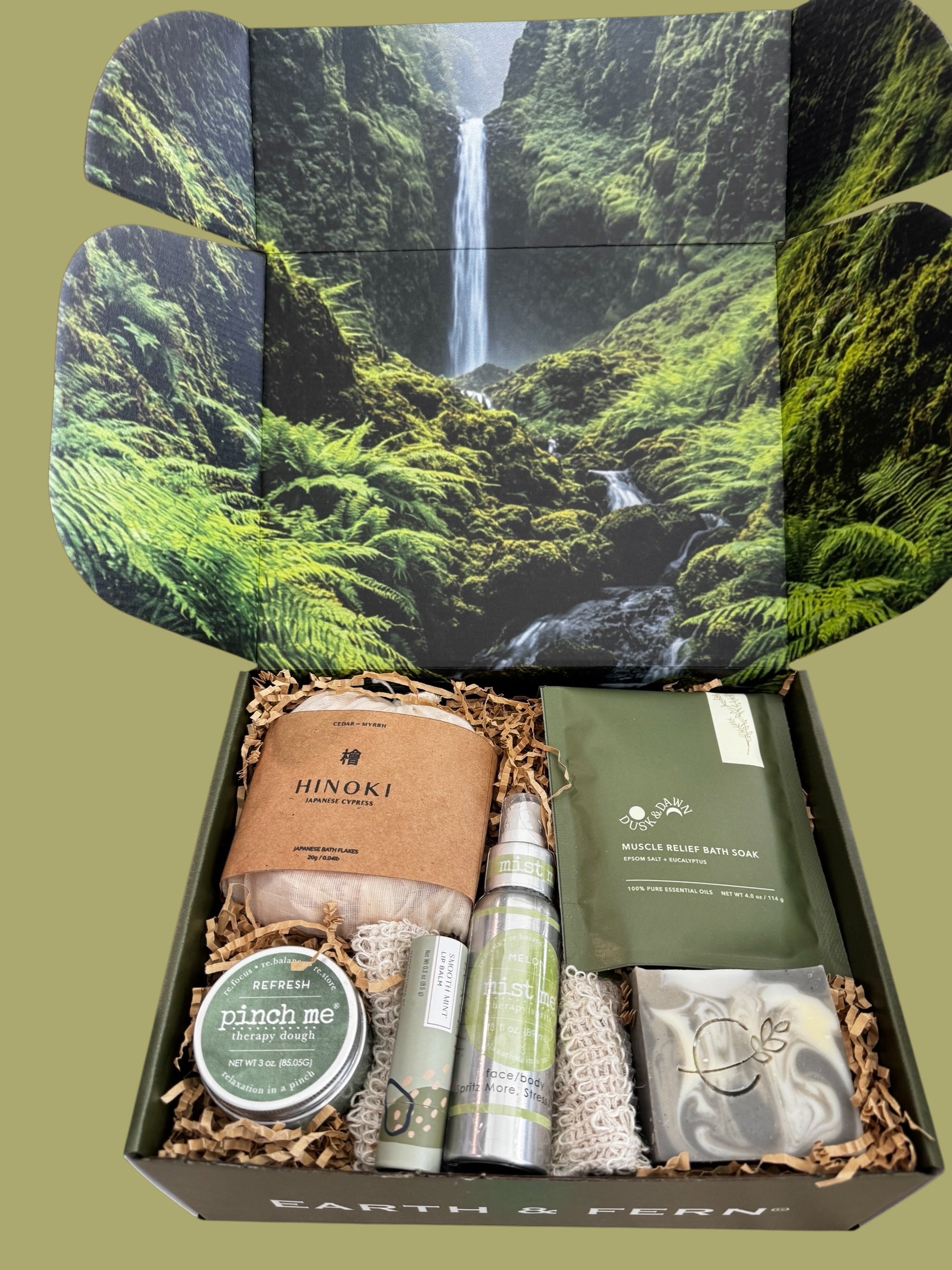 Open Box with Hinoki flakes and muscle bath soak, Aromatherapy spray, therapy dough, mint lip balm and cedarwood pine soap, with a complimentary sisal soap bag.