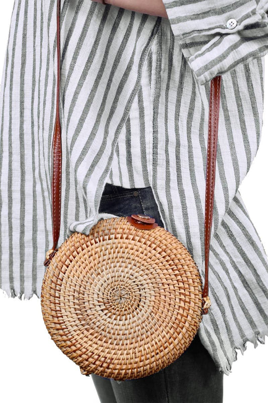 Round macaron-shaped rattan straw crossbody purse with vegan leather strap and magnetic snap closure