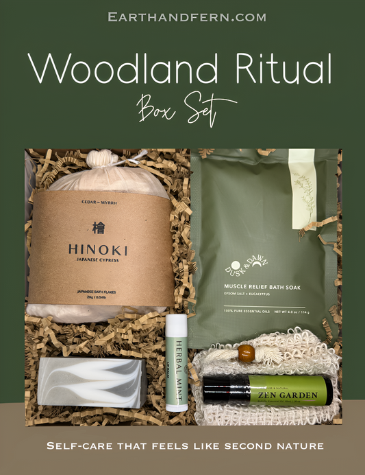 Woodland Ritual wellness box with Hinoki Cypress bath flakes, muscle relief soak, cedarwood pine soap, herbal mint lip balm, and aromatherapy roll-on in a forest-inspired gift set.